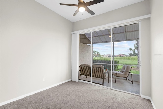 carpeted empty room with ceiling fan and baseboards