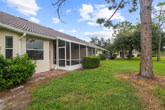 view of yard with a sunroom