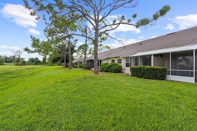 view of yard featuring a sunroom