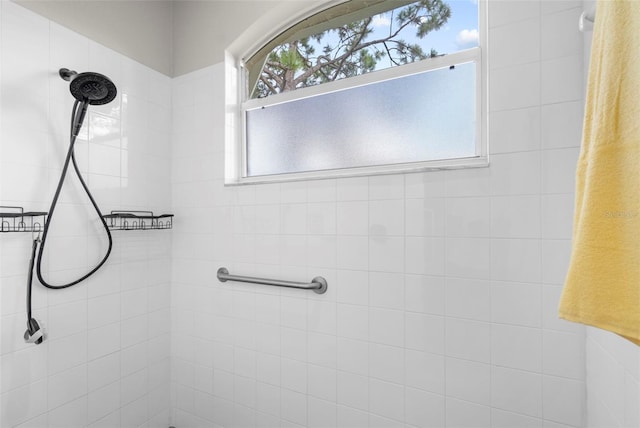 full bathroom with tiled shower