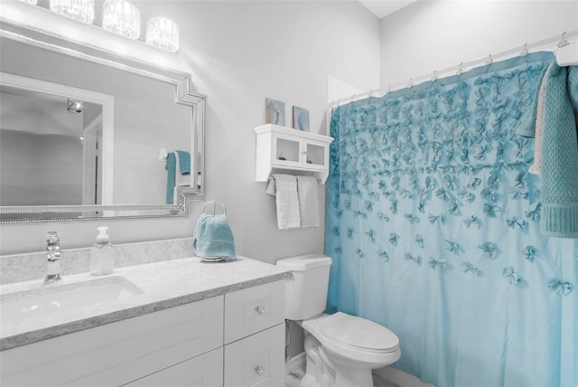 bathroom with vanity, toilet, and a shower with curtain