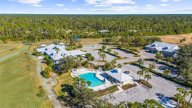 drone / aerial view featuring a view of trees