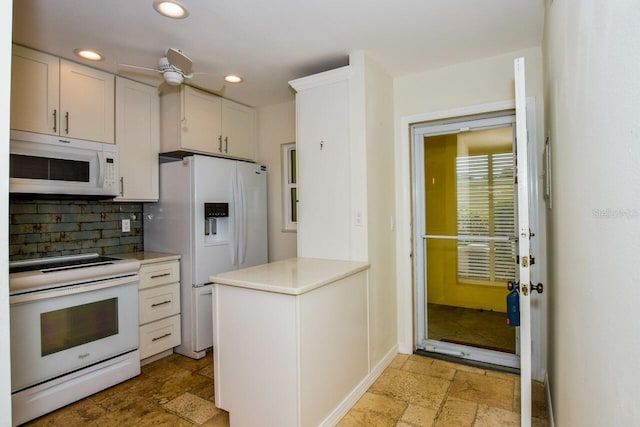 kitchen featuring white cabinets, ceiling fan, white appliances, and backsplash