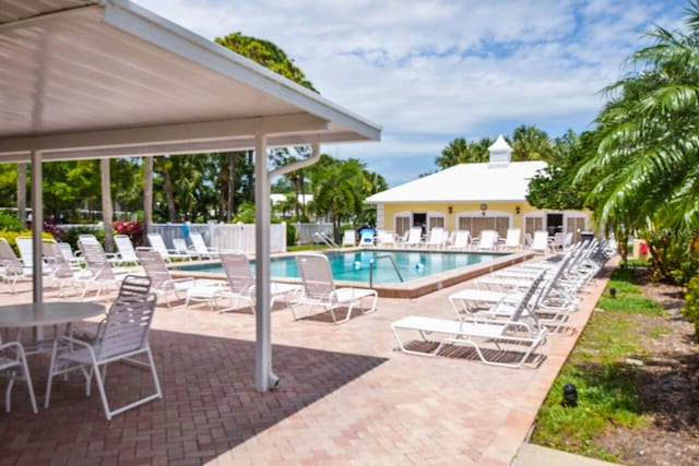 view of swimming pool with a patio area