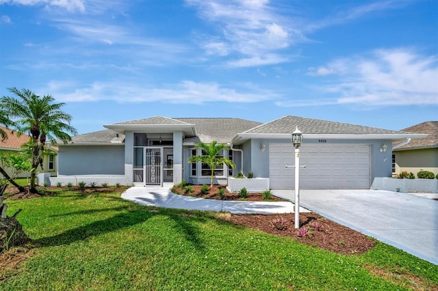 ranch-style home with a garage and a front lawn