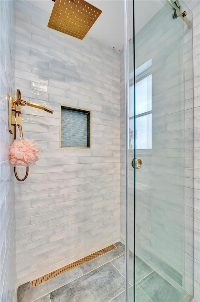 bathroom with a tile shower