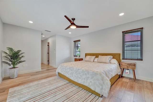 bedroom with light wood-type flooring and ceiling fan