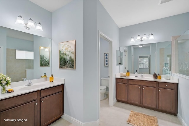 bathroom with toilet, a shower, plenty of natural light, vanity, and tile patterned flooring