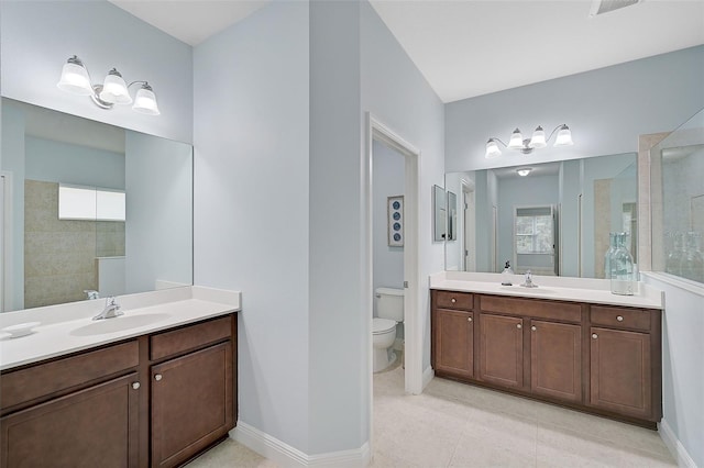 bathroom featuring walk in shower, vanity, toilet, and plenty of natural light