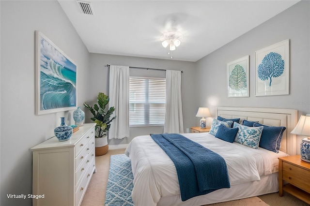 bedroom featuring light carpet