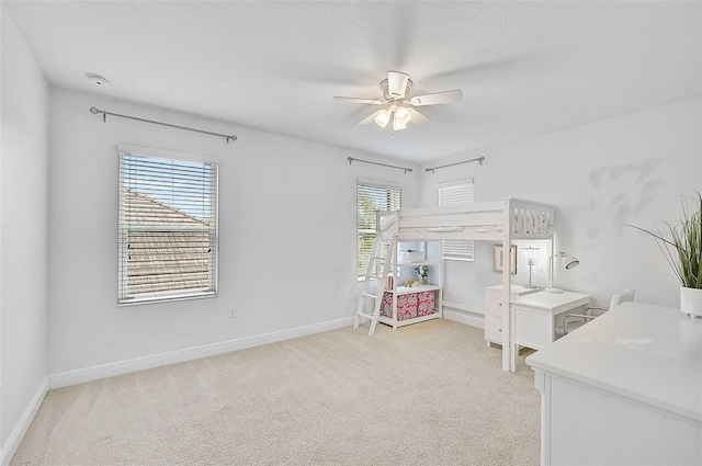 bedroom featuring ceiling fan and light colored carpet