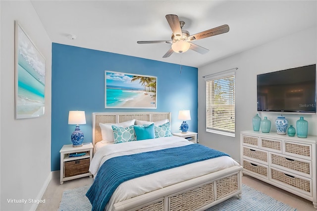 bedroom with ceiling fan and light colored carpet