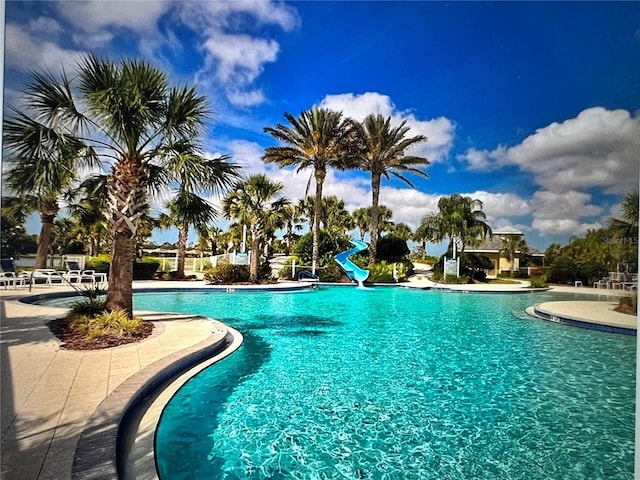 view of pool featuring a water slide