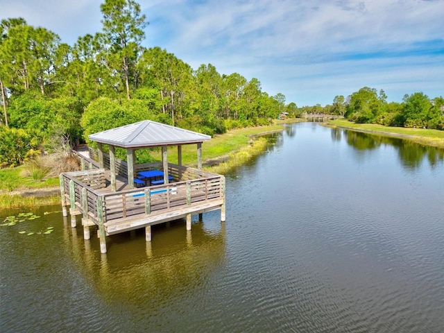 view of dock featuring a gazebo and a water view