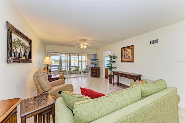 living room featuring ceiling fan and light tile patterned floors