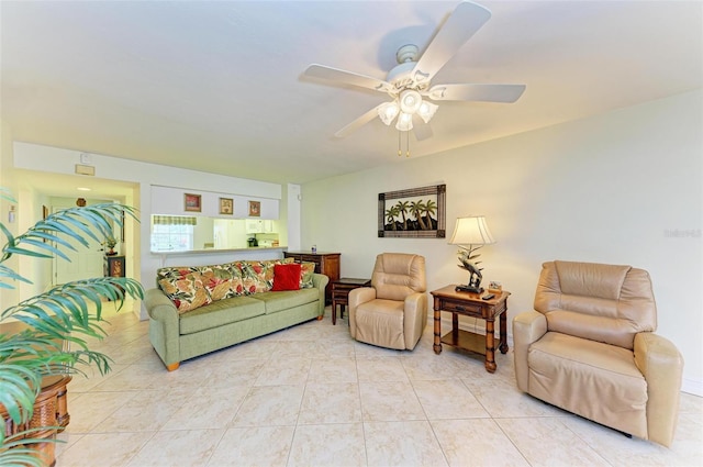 tiled living room with ceiling fan