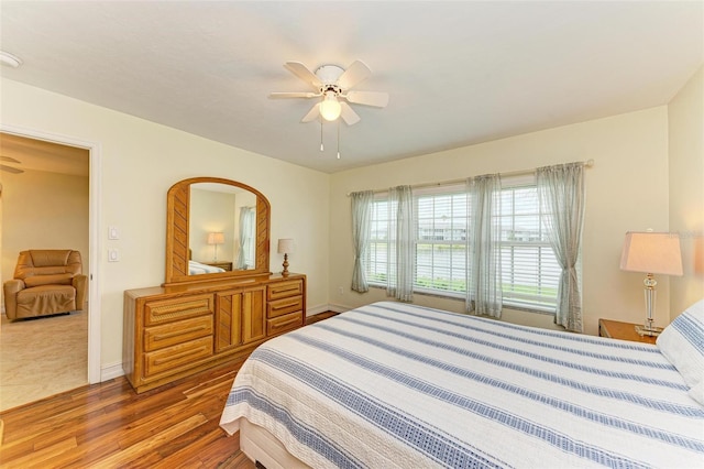 bedroom featuring hardwood / wood-style flooring and ceiling fan