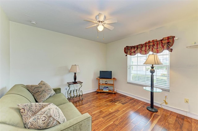 living area featuring light hardwood / wood-style flooring and ceiling fan