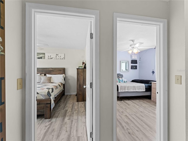 bedroom featuring ceiling fan and light hardwood / wood-style flooring