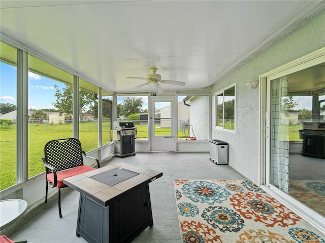 sunroom / solarium with ceiling fan