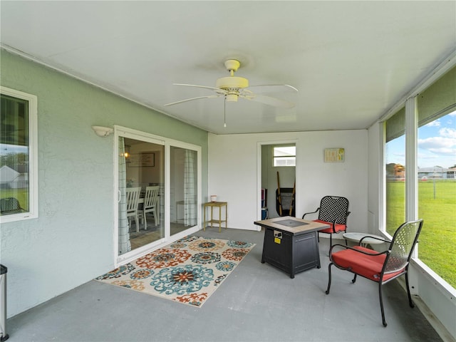 sunroom / solarium with ceiling fan