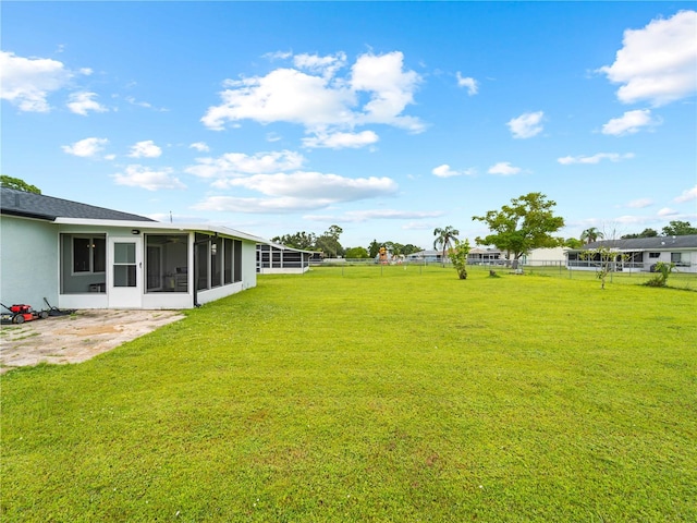 view of yard featuring a sunroom