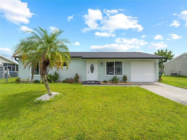 single story home featuring a front lawn and a garage