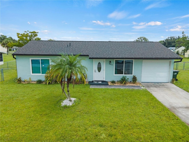 ranch-style house with a garage and a front lawn