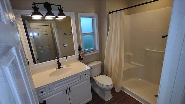 bathroom with a shower with shower curtain, wood-type flooring, toilet, and vanity