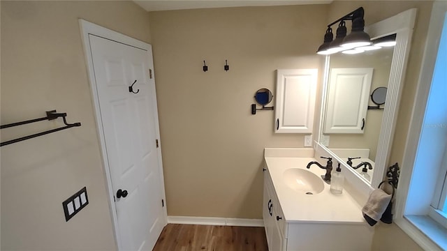 bathroom featuring vanity and hardwood / wood-style floors