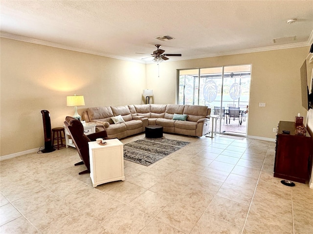 tiled living room with ceiling fan, a textured ceiling, and ornamental molding