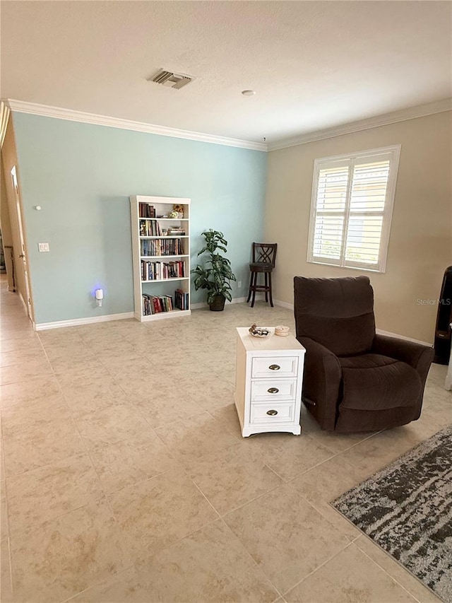 living area featuring crown molding