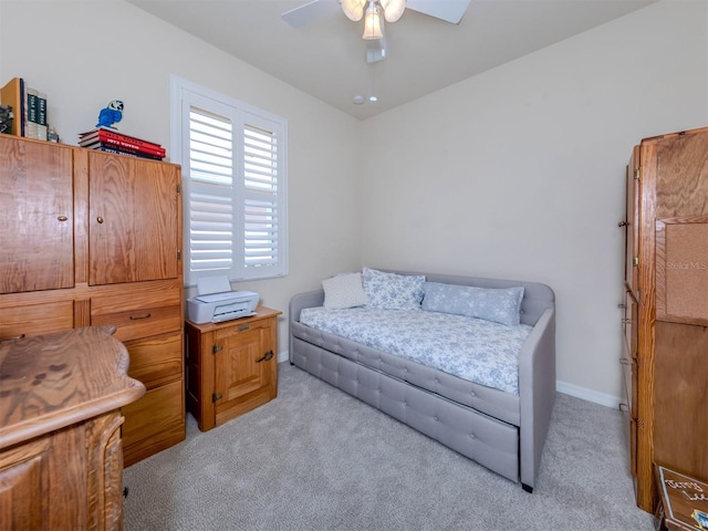 sitting room featuring light colored carpet and ceiling fan