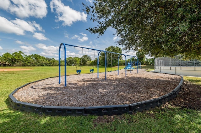 view of playground with a yard