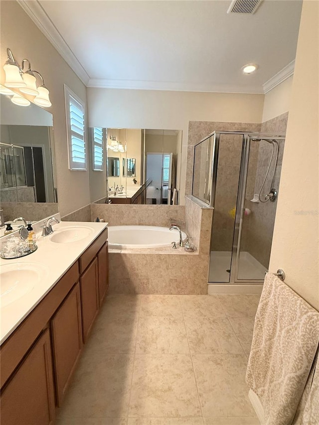 bathroom with vanity, shower with separate bathtub, and ornamental molding