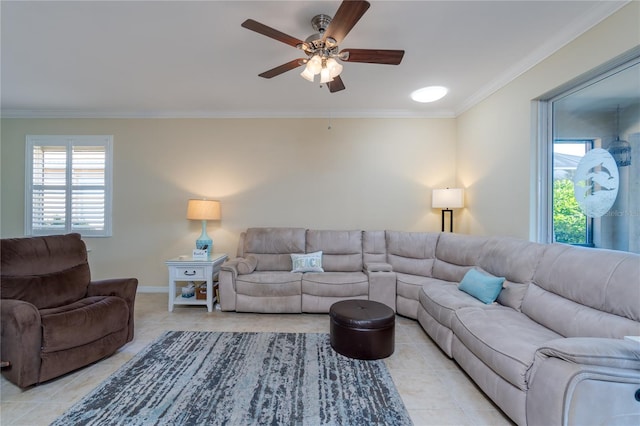 tiled living room featuring ceiling fan, a healthy amount of sunlight, and ornamental molding