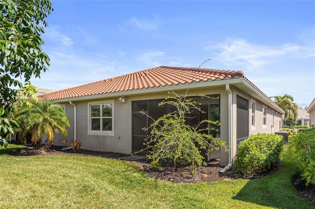 view of home's exterior with a lawn