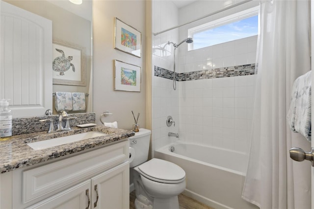 full bath with toilet, shower / bath combo with shower curtain, and vanity