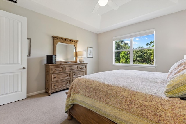 bedroom featuring light carpet, ceiling fan, and baseboards