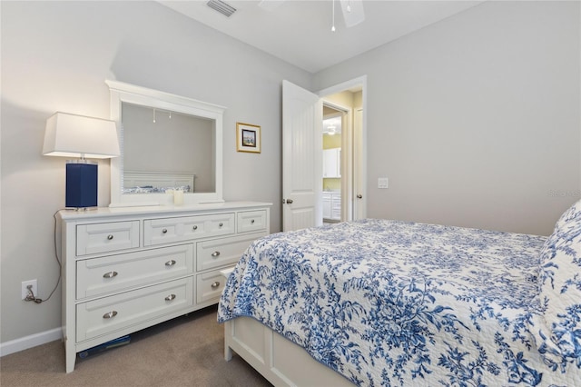 bedroom with dark colored carpet, visible vents, and baseboards