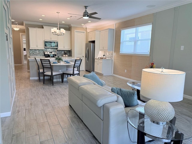 12000 Tapestry Ln, Venice, FL 34293 - living area with recessed lighting, light wood-style flooring, ornamental molding, ceiling fan with notable chandelier, and baseboards
