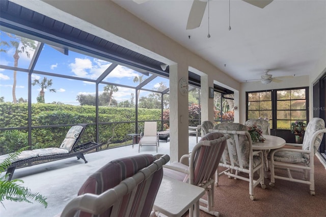 sunroom / solarium featuring ceiling fan