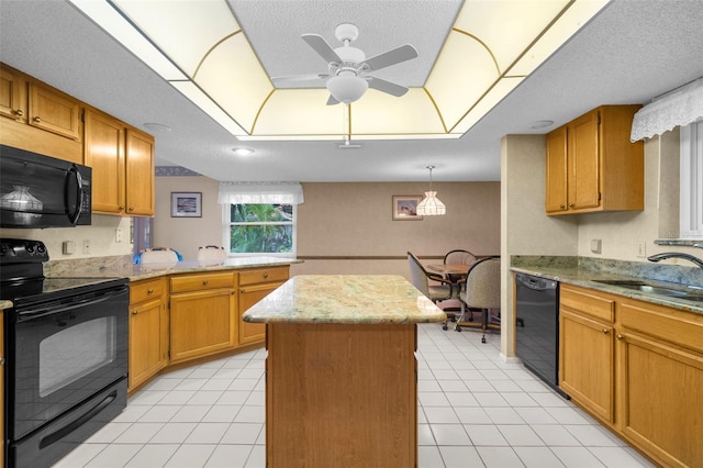 kitchen featuring black appliances, sink, and a textured ceiling