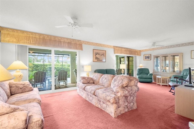 carpeted living room featuring ceiling fan