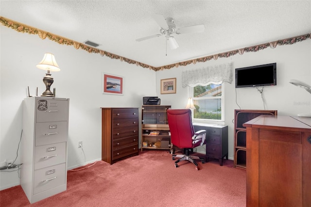 office area featuring ceiling fan, a textured ceiling, and carpet flooring