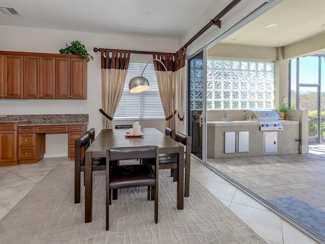 tiled dining area with plenty of natural light