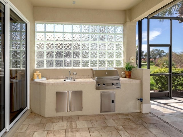 unfurnished sunroom with sink and a wealth of natural light