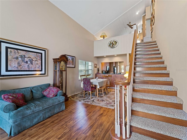 interior space featuring high vaulted ceiling and wood-type flooring