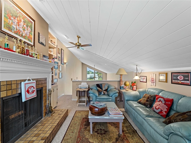 living room featuring lofted ceiling, carpet floors, a fireplace, ceiling fan, and wooden ceiling