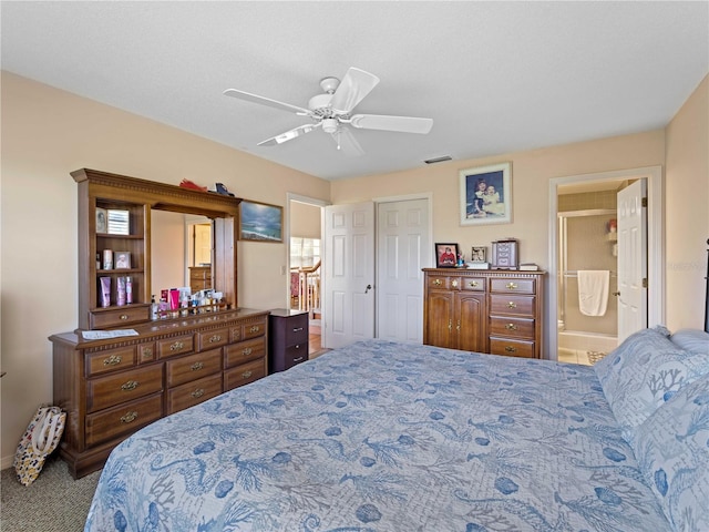 bedroom featuring ensuite bath, ceiling fan, and light colored carpet